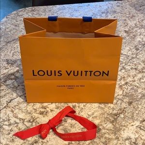 Louis Vuitton shopping bag and ribbon